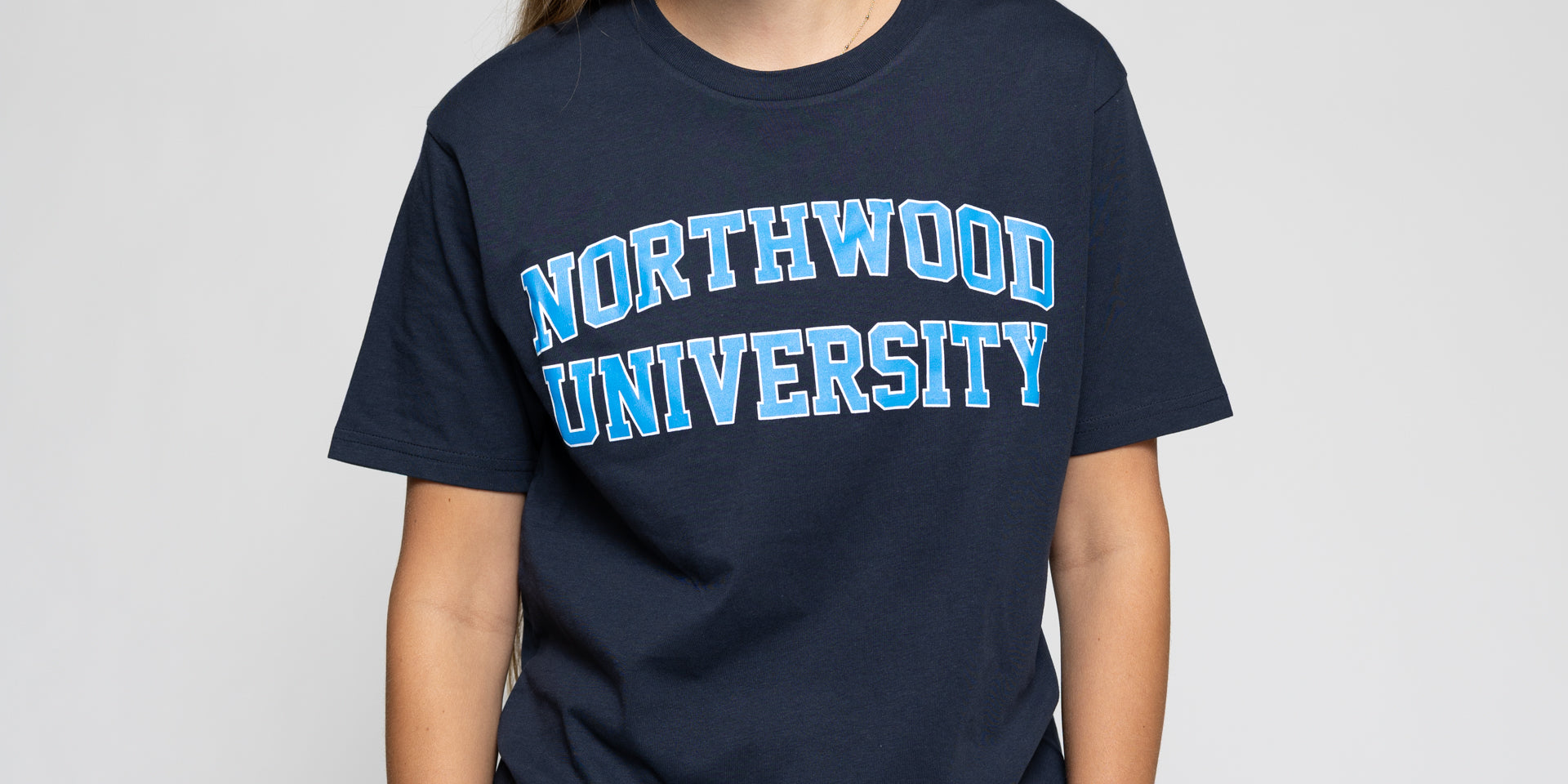 Girl wearing northwood navy tshirt