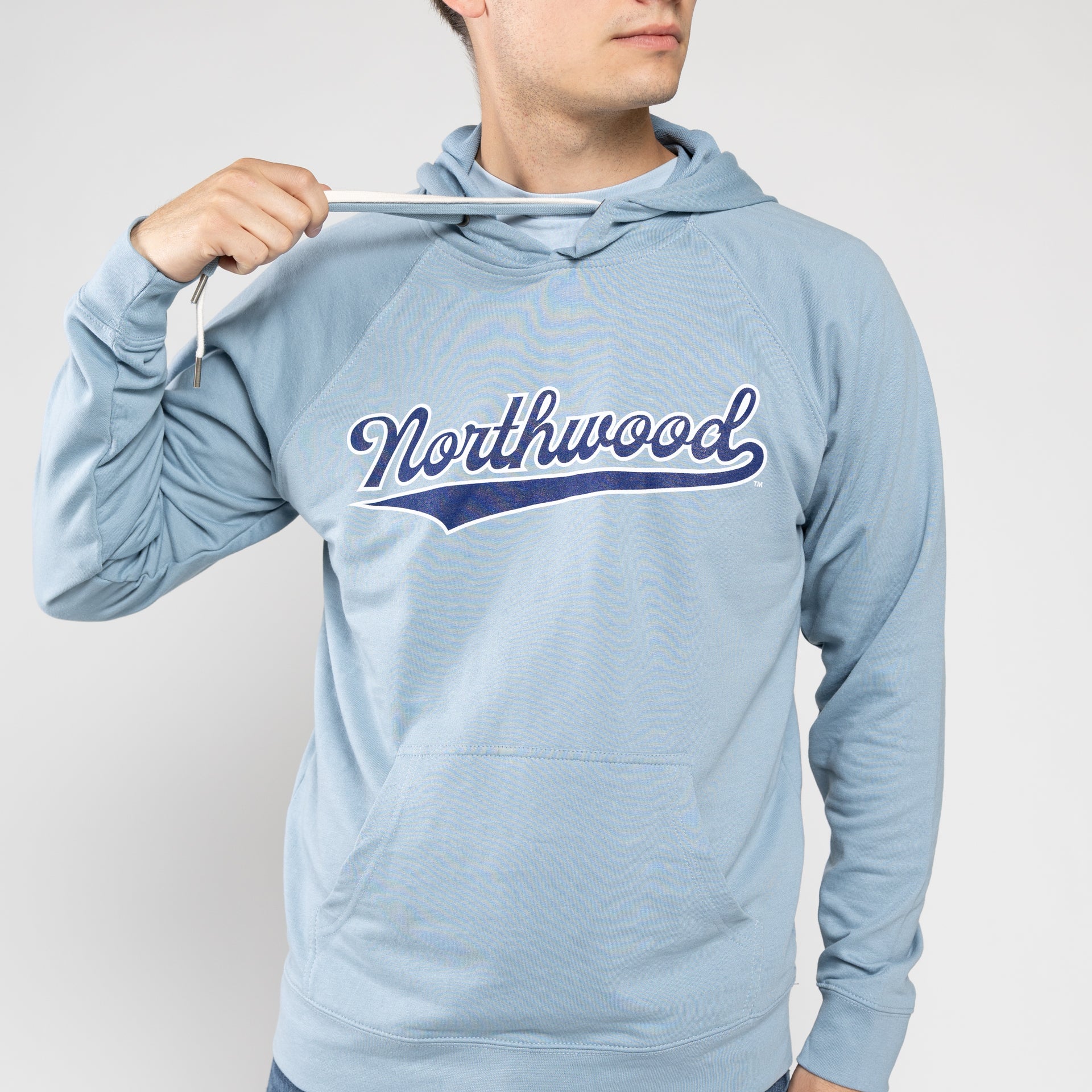 Boy wearing light blue Northwood hoodie