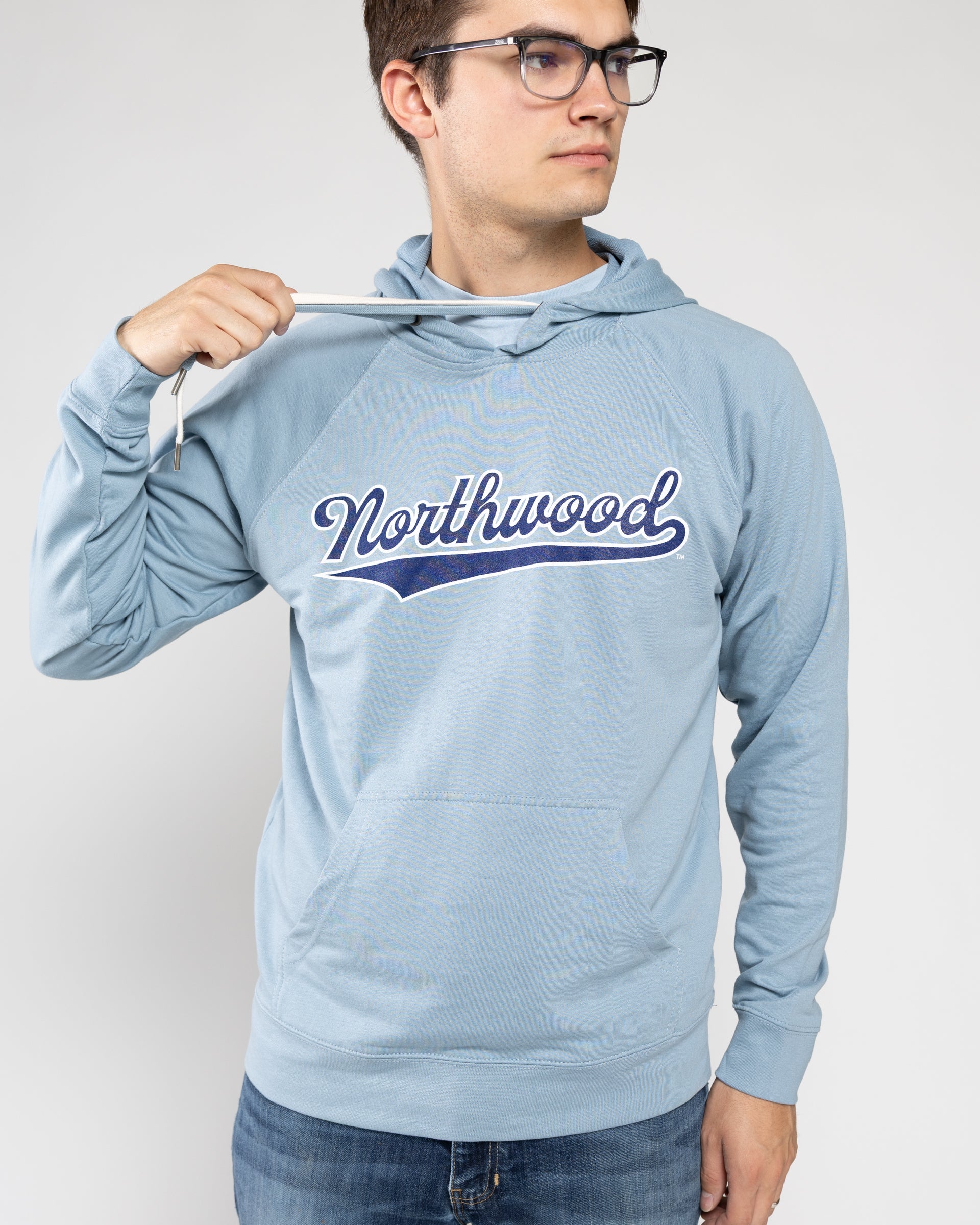 Boy wearing light blue Northwood hoodie
