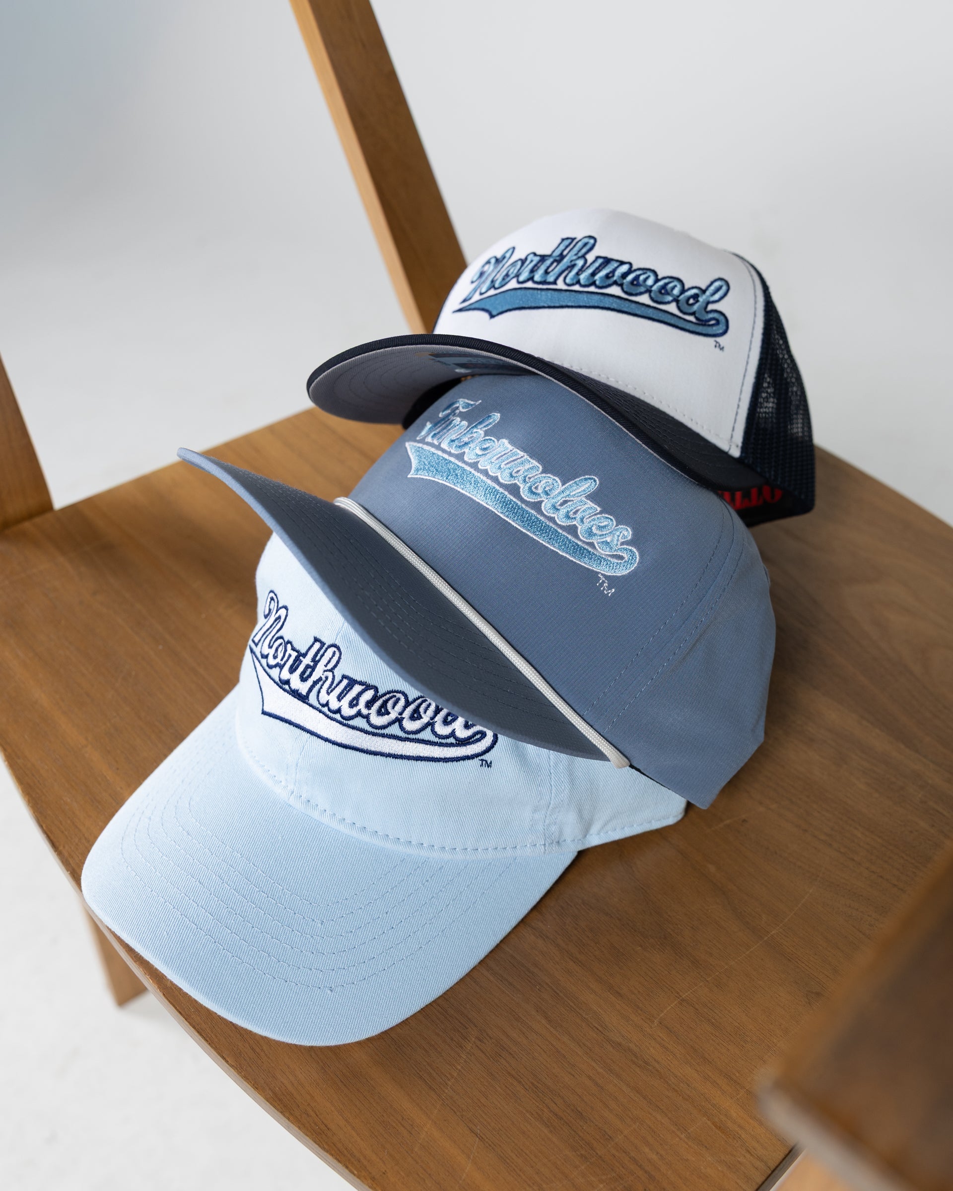 Northwood Hats stacked ontop of eachother